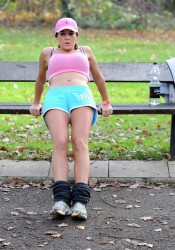 Imogen Thomas Works out in a Park in London