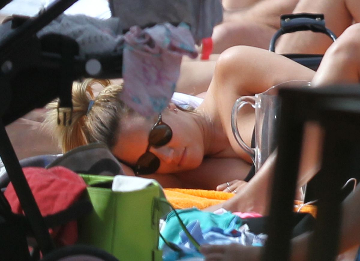 CAROLINE FLACK Relaxing at a Pool in Miami 01/04/2016 - HawtCelebs