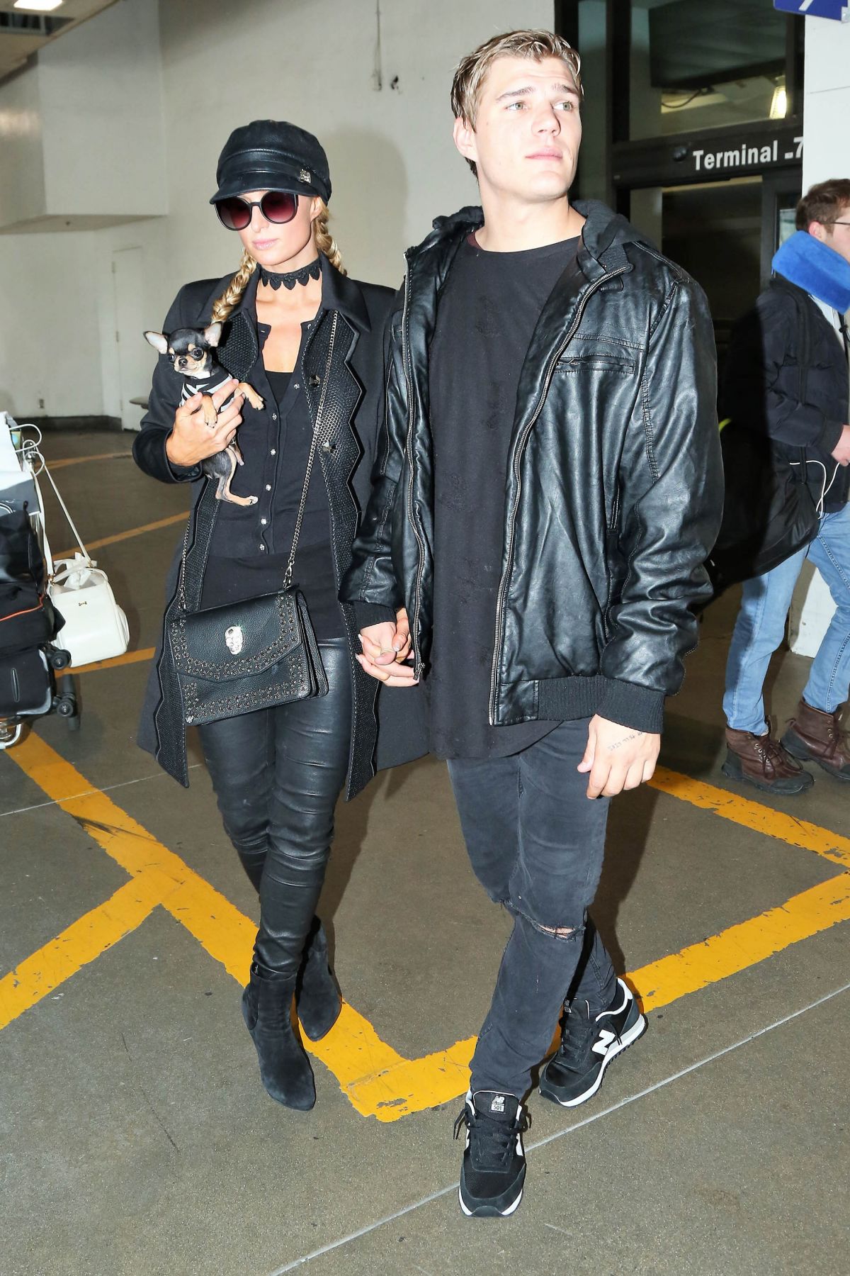 PARIS HILTON and Her Boyfriend Chris Zylka at Los Angeles International Airport 02/19 ...