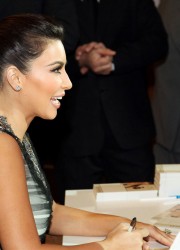 Kim Kardashian Signs Autographs