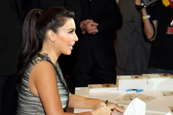 Kim Kardashian Signs Autographs