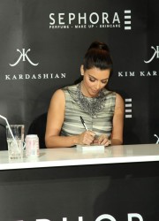 Kim Kardashian Signs Autographs