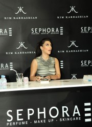 Kim Kardashian Signs Autographs