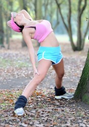 Imogen Thomas Works out in a Park in London
