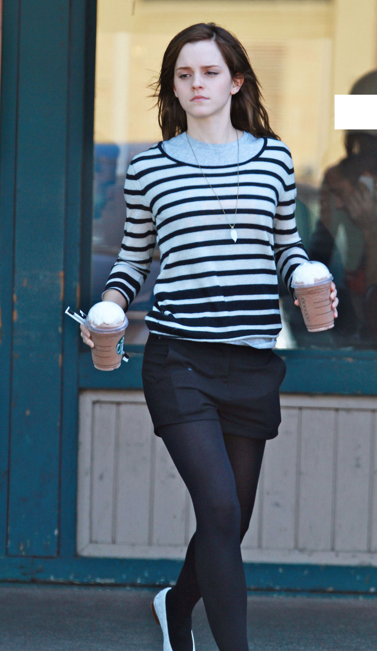 EMMA WATSON Leggy Candids Leaving Starbucks in Los Angeles.