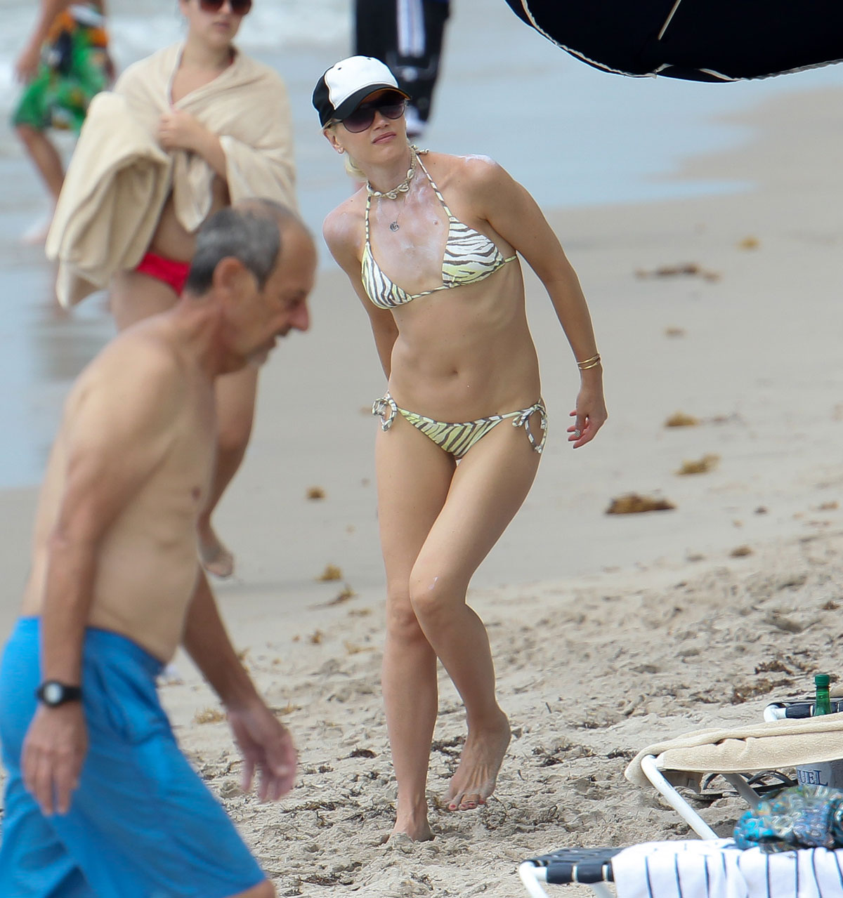 GWEN STEFANI in Bikinis on the Beach in Miami.