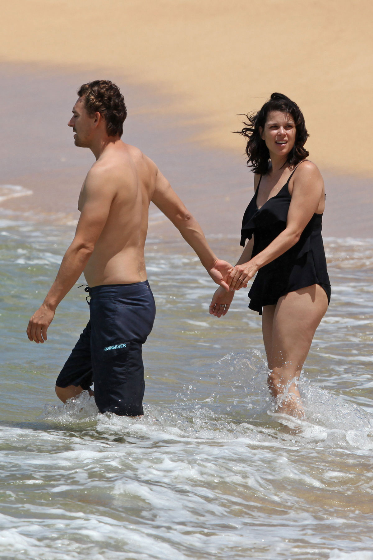 NEVE CAMPBELL in Swimsuit at Beach in Hawaii.