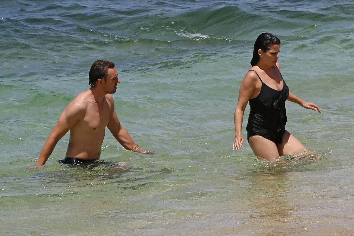 NEVE CAMPBELL in Swimsuit.