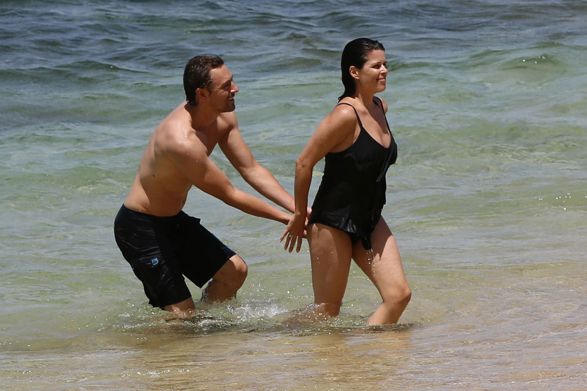 NEVE CAMPBELL in Swimsuit at Beach in Hawaii.