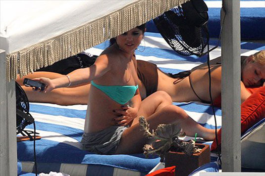 SELENA GOMEZ in Blue Bikini at a Pool in Miami.