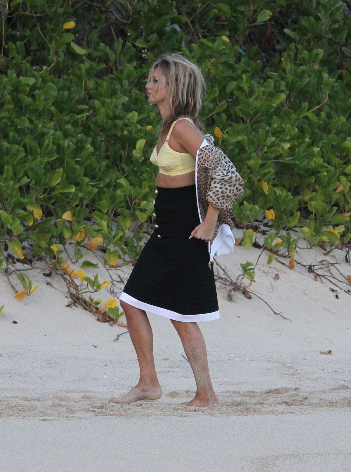 KATE MOSS at a Photoshoot on Governor Beach in St Barts 