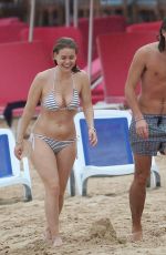 ALICE EVE in Bikini at a Beach in Barbados