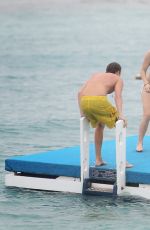 ALICE EVE in Bikini at a Beach in Barbados