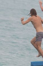 ALICE EVE in Bikini at a Beach in Barbados