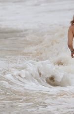 ALICE EVE in Bikini at a Beach in Barbados