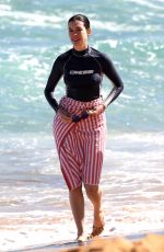 ANNE HATHAWAY in Shorts and Wetsuit Top at a Beach in Hawaii