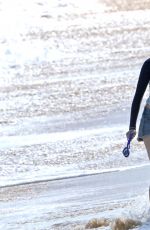 ANNE HATHAWAY in Shorts and Wetsuit Top at a Beach in Hawaii