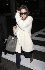EMILIA CLARKE at LAX Airport in Los Angeles