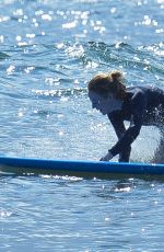 EMMA STONE Surfing in Hawaii