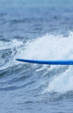 EMMA STONE Surfing in Hawaii