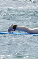 EMMA STONE Surfing in Hawaii