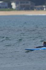 EMMA STONE Surfing in Hawaii