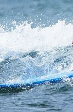 EMMA STONE Surfing in Hawaii