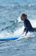 EMMA STONE Surfing in Hawaii