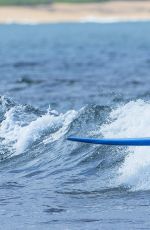 EMMA STONE Surfing in Hawaii