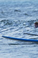 EMMA STONE Surfing in Hawaii