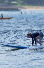 EMMA STONE Surfing in Hawaii
