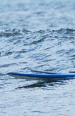 EMMA STONE Surfing in Hawaii
