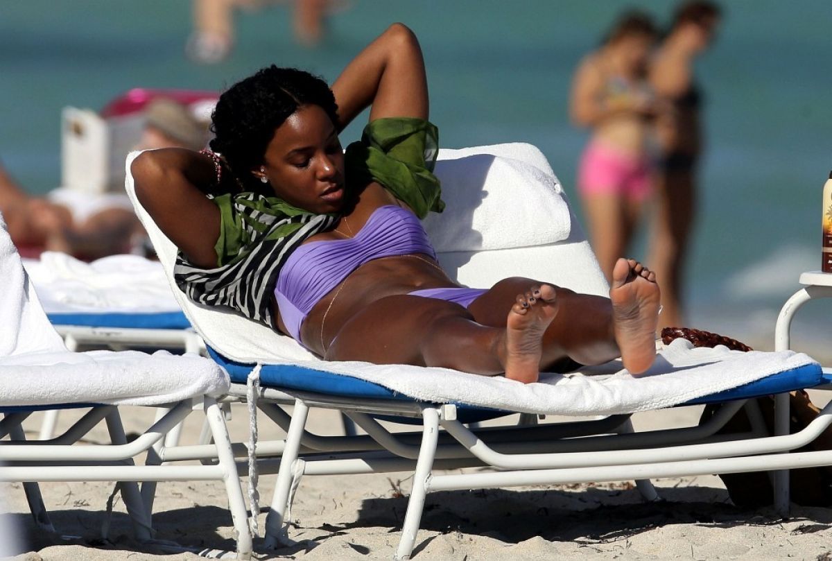 KELLY ROWLAND in Bikini on the Beach in Miami.