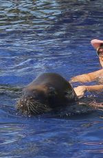 KOURTENY KARDASHIAN in Bikini in the Pool with the Seal