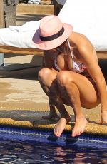 KOURTENY KARDASHIAN in Bikini in the Pool with the Seal