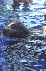 KOURTENY KARDASHIAN in Bikini in the Pool with the Seal