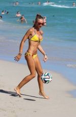 LAURA CREMASCHI in Bikini Playing Football at a Beach in Miami