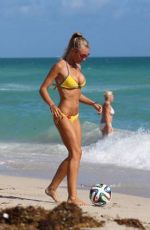 LAURA CREMASCHI in Bikini Playing Football at a Beach in Miami