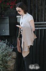 LILY COLLINS Leaves a Friend
