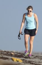 LINDSEY VONN in Shorts Walks Her Dog Leo on the Beach