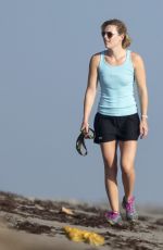 LINDSEY VONN in Shorts Walks Her Dog Leo on the Beach