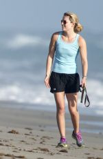 LINDSEY VONN in Shorts Walks Her Dog Leo on the Beach