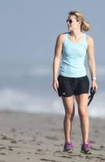 LINDSEY VONN in Shorts Walks Her Dog Leo on the Beach