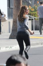MARIA MENOUNOS in Leather Pants on the Set of Extra