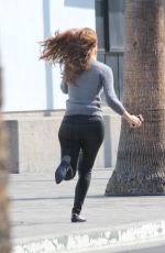 MARIA MENOUNOS in Leather Pants on the Set of Extra