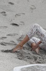 MARYNA LINCHUK at Vogue Photoshoot on Shell Beach in St. Barths