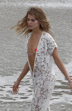 MARYNA LINCHUK at Vogue Photoshoot on Shell Beach in St. Barths
