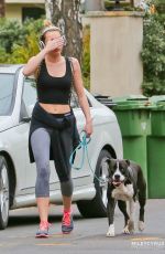 MILEY CYRUS in Tight Walks Her Dog Out in Los Angeles