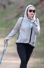 MILEY CYRUS Walking Her Dog Out in Beverly Hills