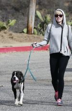 MILEY CYRUS Walking Her Dog Out in Beverly Hills